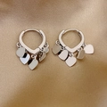 Polished silver heart drop hoop earrings displayed on elegant gold silk fabric background - Alloy/925 Sterling Silver Pin / Hoop 15 (Heart Fringe) / Silver