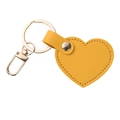 Yellow heart-shaped leather keychain with gold hardware and detailed stitching - Yellow