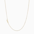 Minimalist gold necklace featuring a delicate chain with a polished letter V pendant - Letter V