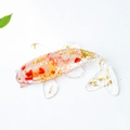 Handcrafted crystal koi fish ornament with red and gold flakes in clear resin base - Koi Fish