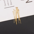Macro shot of 15-20 gold-plated stainless steel T-pins for DIY jewelry making - T-Pin Golden