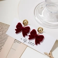 Elegant red flocked bow earrings with golden metallic studs on a white display card - E4535 Bow Spherical Stud Style
