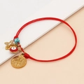 Red braided rope bracelet with golden Saint Benedict medal, evil eye, and turquoise bead - Red
