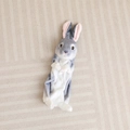 Detailed view of plush rabbit shell with soft gray fur and realistic brown eyes - 30cm (Unstuffed) / Grey (Sitting Shell)