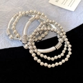 Close-up of silver beaded bracelets with metallic tubes on black and white texture - 7# Bracelet (HB4526)