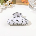 Macro shot of white acrylic hair claw clip with printed black butterfly patterns - 8cm Square Head / Light Grey Butterfly