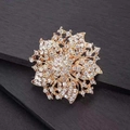 Exquisite gold floral brooch with pavé-set clear crystals and radiant petal design - Gold / White Zirconia