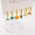 Set of six gold hoop earrings with colorful enamel charms like Noel and rainbow - Card A Set