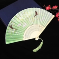 Green folding fan with rabbits, butterflies, and floral patterns on elegant wooden ribs - Style 43