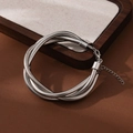 Detailed view of silver braided snake chain bracelet with adjustable lobster clasp - Silver Wound Bracelet
