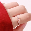 Elegant rose gold branch ring with sparkling marquise diamonds worn on a finger - US 7 / Rose Gold
