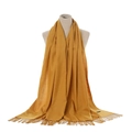 Mustard yellow cashmere-like scarf with fringe details and woven texture - Turmeric