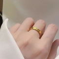 Minimalist 18k gold plated stainless steel fish scale ring shown on a model's hand - Fish Scale Gold