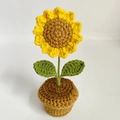 Handmade crochet sunflower potted plant with yellow petals and brown yarn base - Sunflower Potted Plant Finished