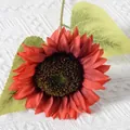 Vibrant red artificial sunflower stem with deep brown core on white fabric background - New Style Sunflower (Red)