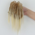 Messy bun hair claw in gradient golden brown to light blonde shades with long loose strands - Honey Blonde Highlights