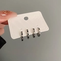 Set of four silver earrings featuring black enamel accents and screw pattern details - Black and White Screw Ring (16# Ear Buckle-Black and White Ring)