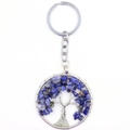 Close-up of tree of life keychain with blue natural crystals and silver wire wrap - Lapis Lazuli