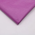 Detailed view of lightweight purple tissue paper with a soft texture for DIY crafts - Fuschia