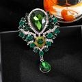 Vintage brooch pendant with pear-shaped green crystal and yellow floral accents - Green