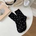 Black crew socks with tulip patterns and beige ruffle trim on a white background - One Size / Black