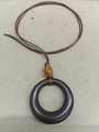 Minimalist resin necklace with dark brown geometric ring and amber-like bead detail - Brown Round Style