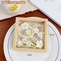 Cremegelbes Blumen-Haarschmuck-Set in einer 11x11cm Geschenkbox-Anzeige - Frangipani 7-teiliges Set (Folienbox)