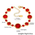 Detail view of gold stainless steel bracelet with faceted red glass and zircon stones - Gold Red