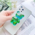 Detail of 3D gradient bear phone griptok with glitter on a white smartphone back - Malachite green