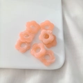 Pink acrylic 5-petal flower beads for DIY jewelry making displayed on a white plate - Pink Marbled 3
