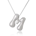 Detail of silver 3D bubble letter M necklace with high-shine polished metallic finish - Letter M