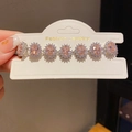 Close-up of pink oval gemstones on a silver-plated bracelet with small zircon accents - 35# Bracelet - Silver - Pink