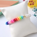 Detailed shot of rainbow clay beads and freshwater pearl bracelet with gold spacer - Rainbow Clay Pearl
