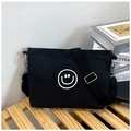 Minimalist black canvas crossbody bag with white smiley face graphic and adjustable strap - Smile Face Style / Black