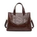 Classic dark brown tote bag with embossed S pattern and adjustable shoulder strap - Embossed Oily Brown