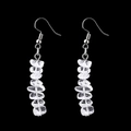 Macro shot of handmade crystal drop earrings with raw quartz stones on black background - Natural Stone Earrings / White Crystal