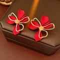 Macro view of French vintage floral earrings with red matte petals and golden wire outlines - Red (Silver Earring Post)