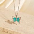 Exquisite silver butterfly necklace with teal gemstones and sparkling rhinestones - BXL0256-17 Blue-Green Gem Butterfly