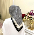 Elegant black and white houndstooth satin square headscarf worn by a female model - Beige White Houndstooth