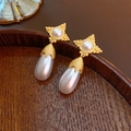 Close-up of vintage baroque style earrings with gold base and drop-shaped white pearls - 103# Silver Earring Post Star Pearl Waterdrop Earrings