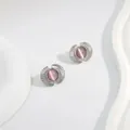 Elegant silver fan-shaped stud earrings featuring a glowing purple cat-eye stone inlay - Pink