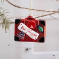 Red suitcase Christmas glass ornament with Bon Voyage text and festive graffiti detail - British Suitcase (Bon Voyage!)