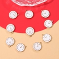 Detailed view of colorful clock enamel charms with gold frames for DIY jewelry - White