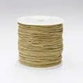 Detailed macro view of 0.8mm light brown waxed thread roll for DIY jewelry making - Color 62 Beige