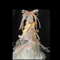 Christmas tree cake decor with pink bows, pearls, and glowing lights on black background - Ballet Style Christmas Tree with Light-Pink & White Bow