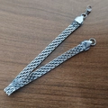 Détail du bracelet gourmette en maille d'acier inoxydable avec fermoir mousqueton - Bracelet Couleur Acier 6mm