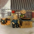 Elderly couple cooking figurines with rustic stove for home decor, 18x14x16cm size - 935-3 Cooking