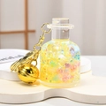 Vibrant yellow milk bottle keychain with star sequins, liquid sand, and gold bell charm - Bell Bottle Style / Yellow
