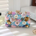 Detail of blue evening clutch bag with pink 3D floral appliques and gold chain handle - Sky Blue