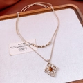 Detail view of silver double-layered snake chain with amber gemstone pendant - Necklace-Light Coffee Gold-Double Layer